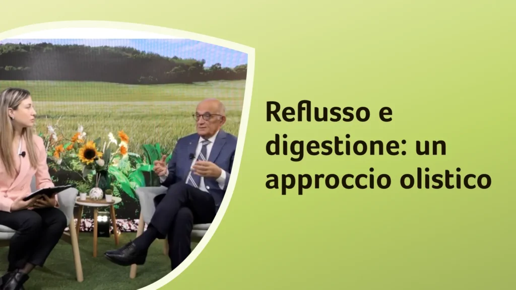 Il dottor Rossi conversa con la dottoressa Freddoni in uno studio con fiori. Sullo sfondo è riportato il titolo dell'episodio "Reflusso e digestione: un approccio olistico"