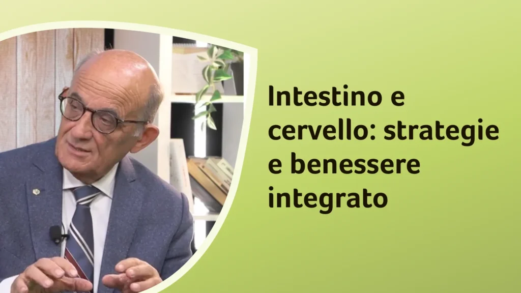 Il dottor Rossi spiega con un gesto delle mani. Sullo sfondo è riportato il titolo dell'episodio "Intestino e cervello: strategie e benessere integrato"